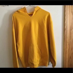 A yellow youths large sweatshirt